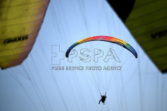 A Paraglider flies from Kozakov Hill