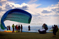 A Paraglider flies from Kozakov Hill