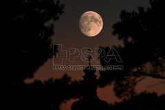 Moon momes out above tower Church of St. James